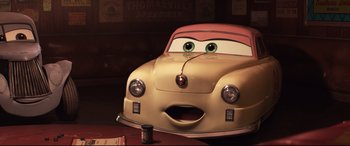 Movie still from “Cars 3” (2017), directed by Brian Fee – The face of a cartoon car; Close Up shot, High angle