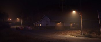 Movie still from “Cars 3” (2017), directed by Brian Fee – A car is parked in front of a house at night; Extreme Wide shot, High angle