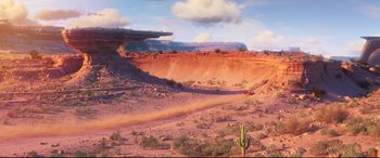 Movie still from “Cars 3” (2017), directed by Brian Fee – An image of a desert scene with a cactus; Extreme Wide shot, High angle