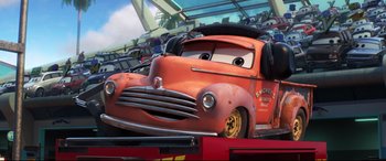 Movie still from “Cars 3” (2017), directed by Brian Fee – The face of an old red truck; Medium shot, Low angle