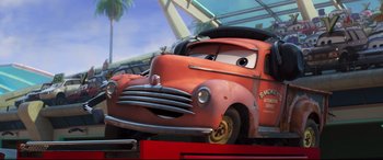 Movie still from “Cars 3” (2017), directed by Brian Fee – The face of a cartoon car; Medium shot, Low angle