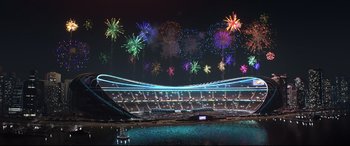 Movie still from “Cars 3” (2017), directed by Brian Fee – Fireworks are being displayed over a stadium at night; Extreme Wide shot, High angle
