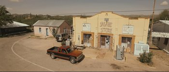 Movie still from “Cartel Land” (2015), directed by Matthew Heineman – An old truck parked in front of a building; Extreme Wide shot, High angle
