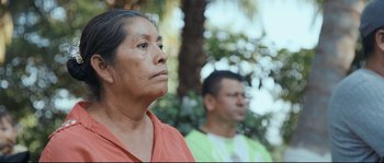 Movie still from “Cartel Land” (2015), directed by Matthew Heineman – A woman and a man are standing in front of a tree; Close Up shot, Over the shoulder angle