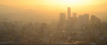 Movie still from “Cartel Land” (2015), directed by Matthew Heineman – A view of a city skyline at sunset; Extreme Wide shot, High angle