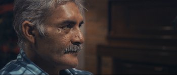 Movie still from “Cartel Land” (2015), directed by Matthew Heineman – An older man with a mustache looking to his left; Close Up shot, Over the shoulder angle