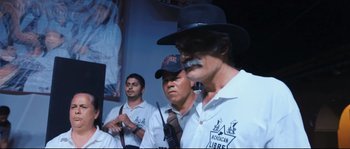 Movie still from “Cartel Land” (2015), directed by Matthew Heineman – A group of men standing next to each other; Medium shot, Low angle