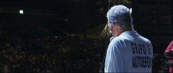 Movie still from “Cartel Land” (2015), directed by Matthew Heineman – A man standing in front of a crowd of people; Medium shot, Low angle