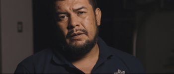 Movie still from “Cartel Land” (2015), directed by Matthew Heineman – A person with a beard; Close Up shot, Over the shoulder angle