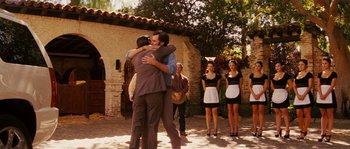 Movie still from “Casa de mi Padre” (2012), directed by Matt Piedmont – A couple of people that are hugging each other; Wide shot, Over the shoulder angle