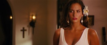 Movie still from “Casa de mi Padre” (2012), directed by Matt Piedmont – A woman in a white top looking at the camera; Close Up shot, Over the shoulder angle