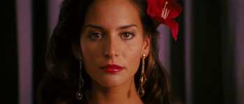 Movie still from “Casa de mi Padre” (2012), directed by Matt Piedmont – A person with a flower in her hair; Close Up shot, Over the shoulder angle