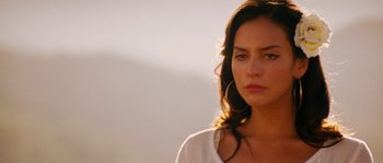 Movie still from “Casa de mi Padre” (2012), directed by Matt Piedmont – A beautiful woman standing in front of a sky background; Close Up shot, Low angle
