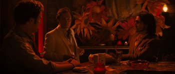 Movie still from “Casa de mi Padre” (2012), directed by Matt Piedmont – A man sitting at a table with a candle; Medium shot, Over the shoulder angle
