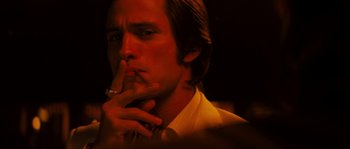 Movie still from “Casa de mi Padre” (2012), directed by Matt Piedmont – A person wearing a suit and tie; Close Up shot, Low angle