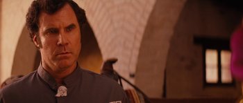 Movie still from “Casa de mi Padre” (2012), directed by Matt Piedmont – A person wearing a gray shirt; Close Up shot, Over the shoulder angle