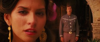 Movie still from “Casa de mi Padre” (2012), directed by Matt Piedmont – A man and a woman are standing in a room; Close Up shot, Low angle