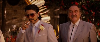 Movie still from “Casa de mi Padre” (2012), directed by Matt Piedmont – A man in a suit and tie next to another man in a suit and tie; Close Up shot, Low angle