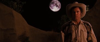 Movie still from “Casa de mi Padre” (2012), directed by Matt Piedmont – A person standing in front of the moon at night; Medium shot, Low angle