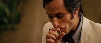 Movie still from “Casa de mi Padre” (2012), directed by Matt Piedmont – A person holding a pen in his mouth; Close Up shot, High angle