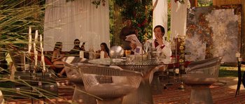 Movie still from “Casa de mi Padre” (2012), directed by Matt Piedmont – A group of people sitting around a table; Wide shot, Over the shoulder angle