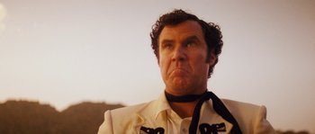 Movie still from “Casa de mi Padre” (2012), directed by Matt Piedmont – A person wearing a suit and tie; Close Up shot, Low angle