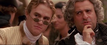 Movie still from “Casanova” (2005), directed by Lasse Hallström – A person wearing sunglasses and a wig; Close Up shot, Over the shoulder angle