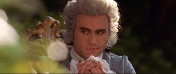 Movie still from “Casanova” (2005), directed by Lasse Hallström – A person wearing a wig and a bow tie; Close Up shot, Over the shoulder angle