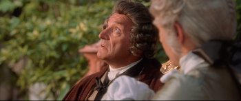 Movie still from “Casanova” (2005), directed by Lasse Hallström – An older man looking up into the sky while holding his hand up to his face; Close Up shot, Over the shoulder angle
