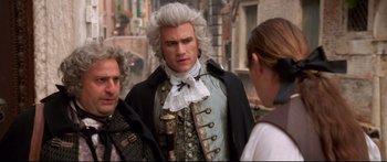 Movie still from “Casanova” (2005), directed by Lasse Hallström – A man in a wig and a wig stands next to two other men; Medium shot, Over the shoulder angle