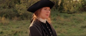 Movie still from “Casanova” (2005), directed by Lasse Hallström – A woman wearing a black hat and a black coat; Close Up shot, Over the shoulder angle