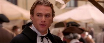 Movie still from “Casanova” (2005), directed by Lasse Hallström – A person wearing a suit and bow tie; Close Up shot, Over the shoulder angle