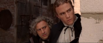Movie still from “Casanova” (2005), directed by Lasse Hallström – Two men dressed in period clothing posing for a picture; Close Up shot, Over the shoulder angle