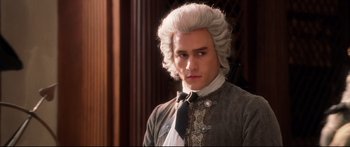 Movie still from “Casanova” (2005), directed by Lasse Hallström – A man in a wig and a bow tie; Close Up shot, Low angle