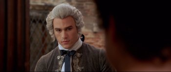 Movie still from “Casanova” (2005), directed by Lasse Hallström – A man in a wig and a bow tie; Close Up shot, Over the shoulder angle
