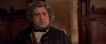 Movie still from “Casanova” (2005), directed by Lasse Hallström – A person wearing a suit and tie; Close Up shot, Over the shoulder angle