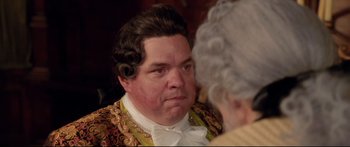Movie still from “Casanova” (2005), directed by Lasse Hallström – A man in a wig and a wig looking at an older woman; Close Up shot, Over the shoulder angle