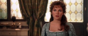 Movie still from “Casanova” (2005), directed by Lasse Hallström – A woman with long brown curly hair wearing a blue dress; Close Up shot, Over the shoulder angle
