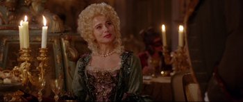 Movie still from “Casanova” (2005), directed by Lasse Hallström – A woman in a period dress with a candle in the background; Close Up shot, Over the shoulder angle