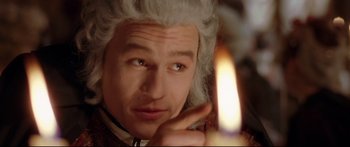 Movie still from “Casanova” (2005), directed by Lasse Hallström – A person holding a lit candle; Close Up shot, High angle