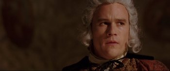 Movie still from “Casanova” (2005), directed by Lasse Hallström – A person wearing a suit and tie; Close Up shot, Low angle