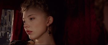 Movie still from “Casanova” (2005), directed by Lasse Hallström – A beautiful young lady wearing a pair of earrings; Close Up shot, Over the shoulder angle