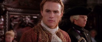 Movie still from “Casanova” (2005), directed by Lasse Hallström – A person wearing a suit and tie; Close Up shot, Over the shoulder angle