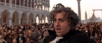 Movie still from “Casanova” (2005), directed by Lasse Hallström – A person with a crowd of people in the background; Close Up shot, Over the shoulder angle