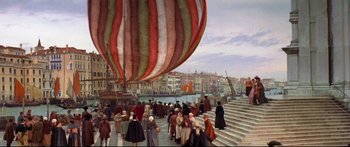 Movie still from “Casanova” (2005), directed by Lasse Hallström – A group of people standing around a large balloon; Extreme Wide shot, High angle