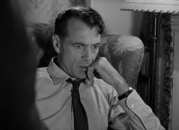 Movie still from “Casanova Brown” (1944), directed by Sam Wood – A black - and - white photo of a man in a suit and tie; Close Up shot, High angle