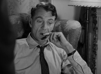 Movie still from “Casanova Brown” (1944), directed by Sam Wood – An older man wearing a neck tie while eating something; Close Up shot, High angle