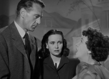 Movie still from “Casanova Brown” (1944), directed by Sam Wood – A man and two women talking to each other; Medium shot, Low angle