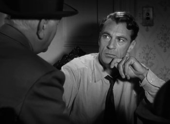 Movie still from “Casanova Brown” (1944), directed by Sam Wood – A man is talking to another man in a room; Close Up shot, Over the shoulder angle