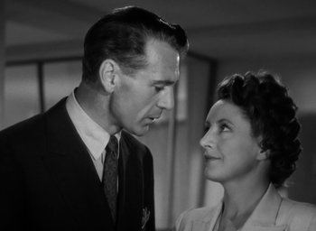 Movie still from “Casanova Brown” (1944), directed by Sam Wood – A man and a woman looking at one another; Close Up shot, Low angle